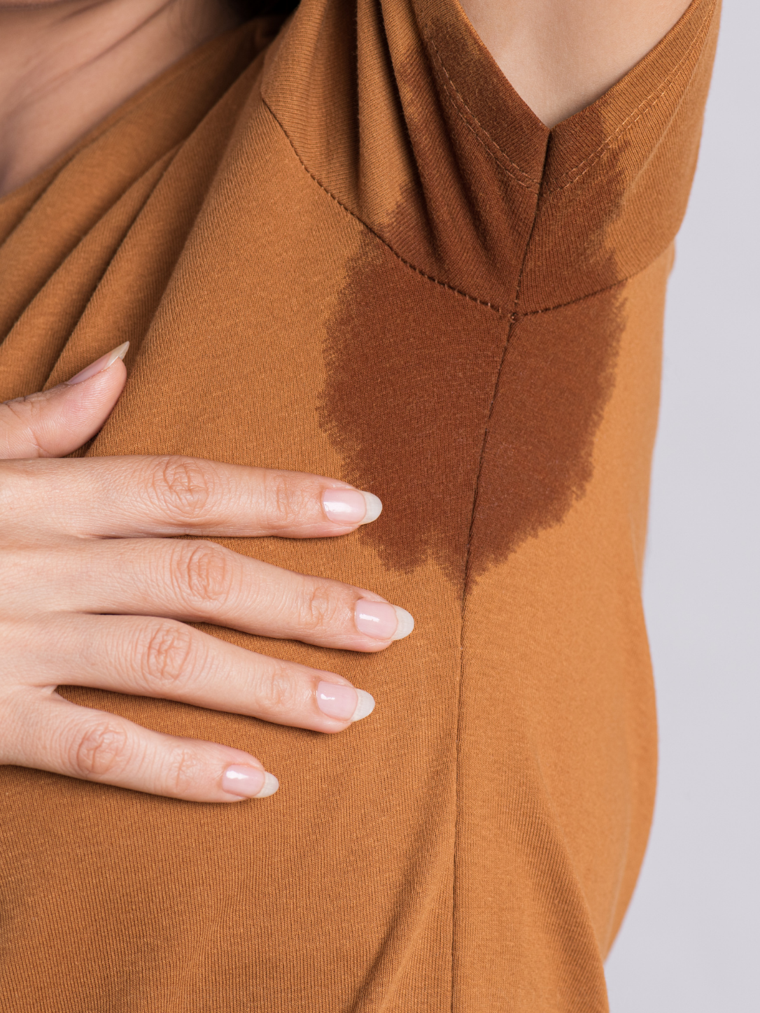 Clothing with visible sweat stain from hyperhidrosis