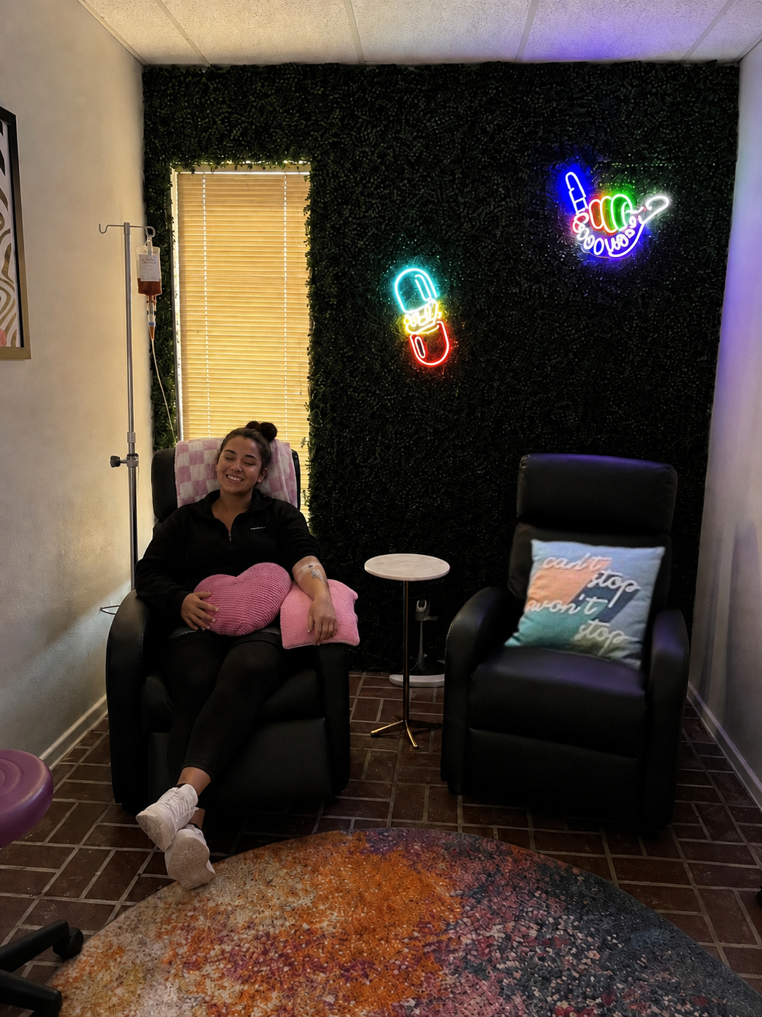 Patient relaxing in a comfortable recliner during her IV iron infusion at Happy Drip IV & Wellness